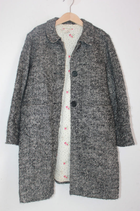 tweedehands zwart met ecru gemeleerde jas van bonpoint in maat 134-140 voor een meisje