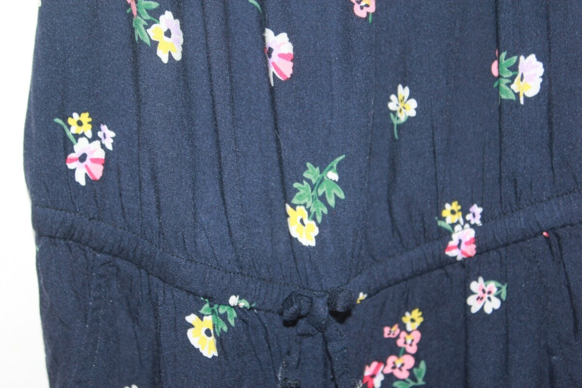 tweedehands donkerblauwe zomerse mouwloze jumpsuit met bloemenprint in multicolour van H&M in maat 104 voor een meisje